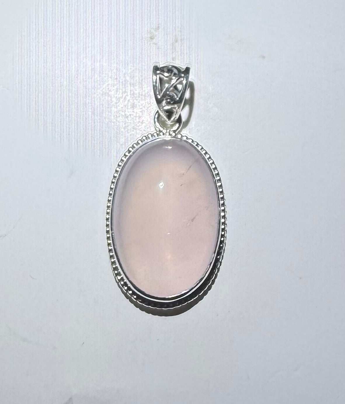 Oval Rose Quartz Pendant with Beveled Border in Sterling Silver